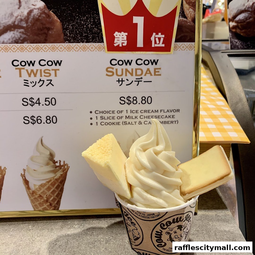 A close-up of a Cow Cow Sundae from Tokyo Milk Cheese Factory, featuring soft-serve ice cream with cheesecake slices.