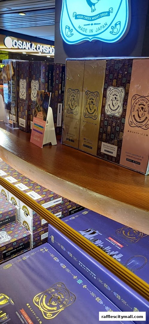 A display of Tokyo Milk Cheese Factory cookies in various flavors and packaging.