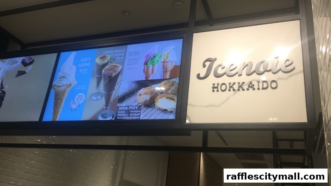 A digital menu board displaying various ice cream and pastry items from Icenoie Hokkaido.