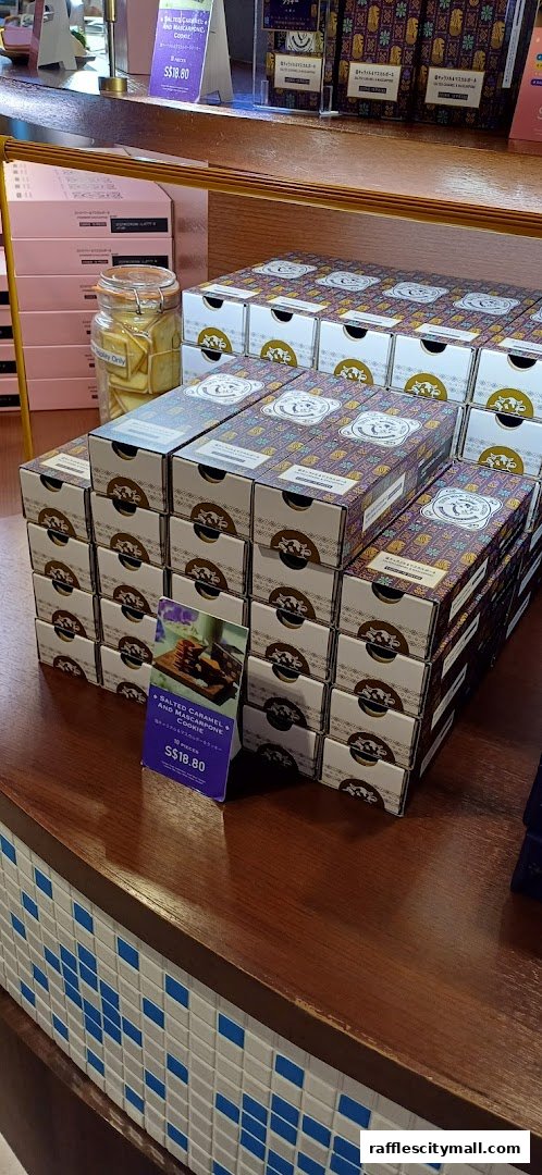 Stacks of gift boxes and a display of cookies at Tokyo Milk Cheese Factory.