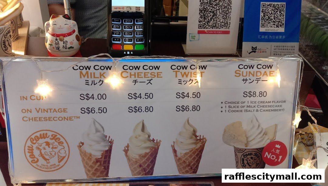 A menu board displaying various ice cream flavors and prices from Tokyo Milk Cheese Factory.