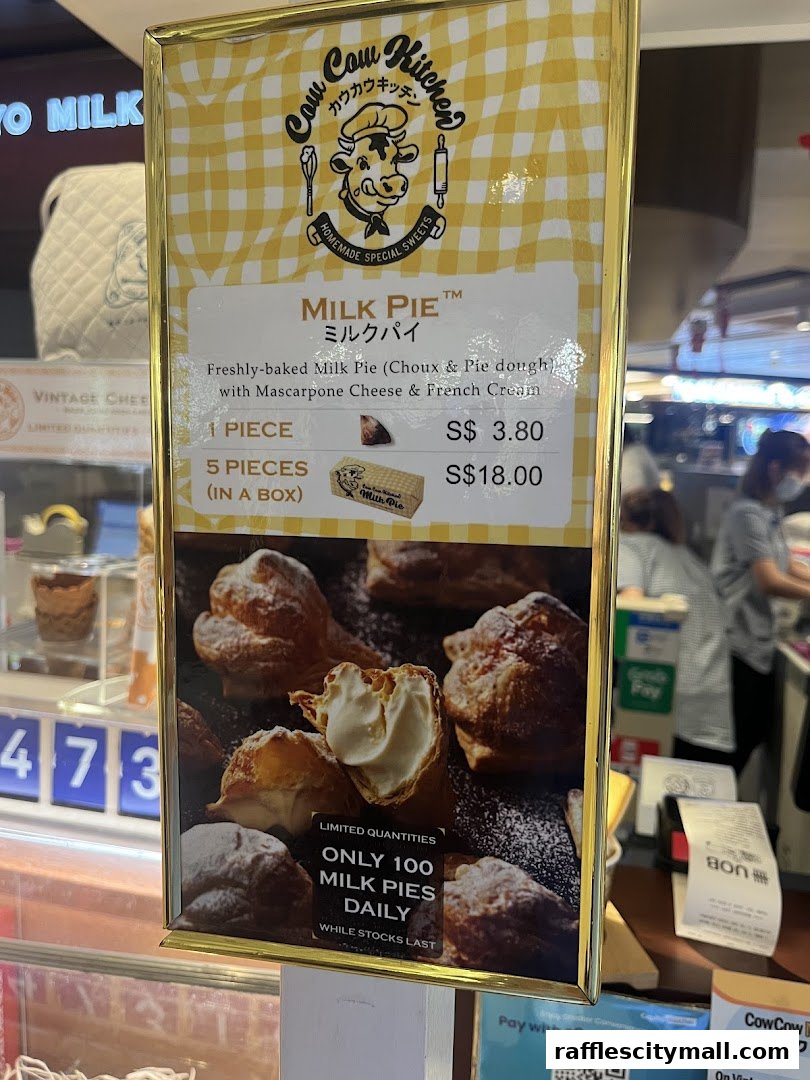 A menu board for Tokyo Milk Cheese Factory featuring their signature Milk Pie.