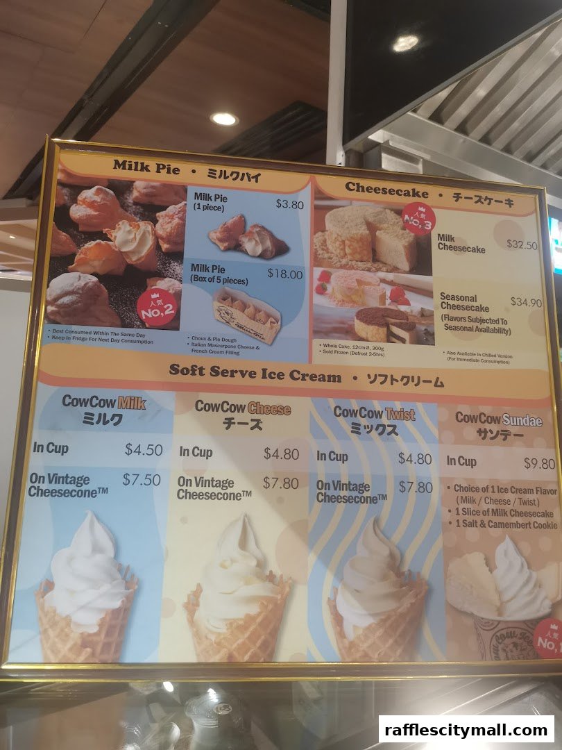 A menu board displaying various milk pies, cheesecakes, and soft-serve ice creams with prices.