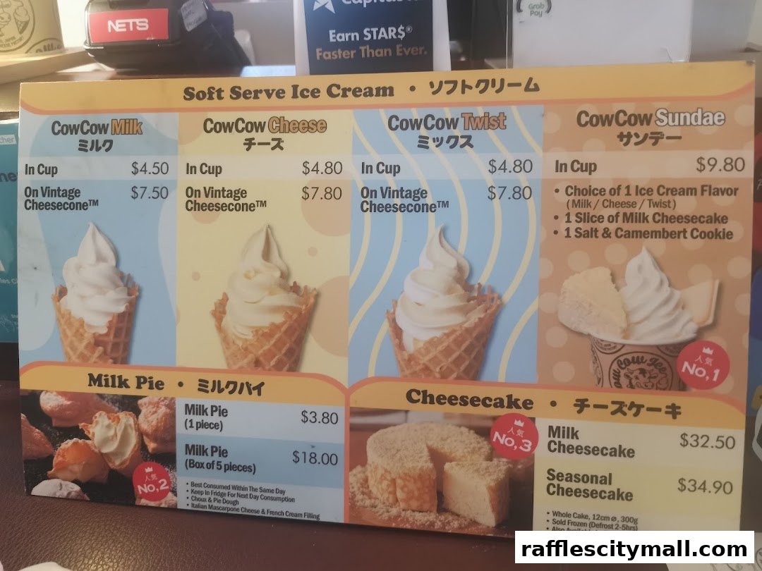 A menu board displaying various ice cream and cheesecake products from Tokyo Milk Cheese Factory.
