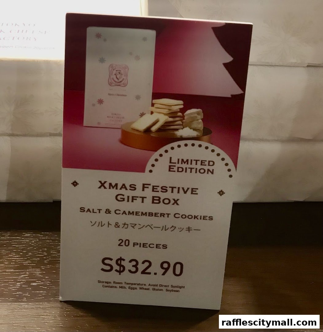 A sign advertising a limited edition Christmas gift box of Salt & Camembert Cookies.