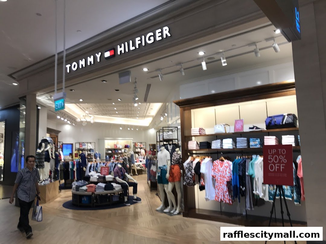 Interior view of a Tommy Hilfiger store with clothing displays and mannequins.
