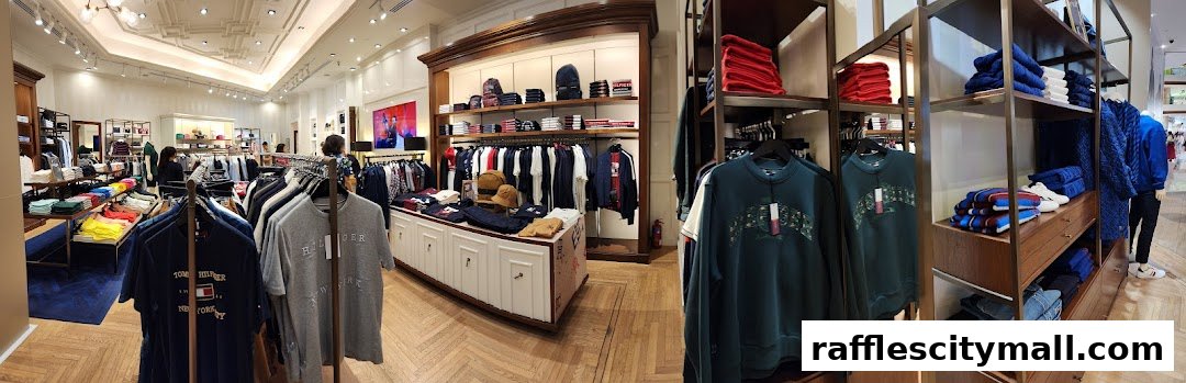 Interior view of a Tommy Hilfiger store showcasing a variety of apparel and accessories.