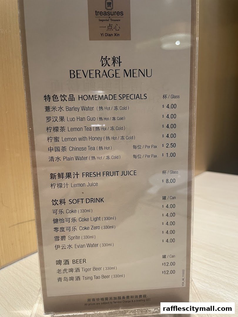 A beverage menu from Treasures Yi Dian Xin, featuring homemade specials, fresh juices, soft drinks, and beer.