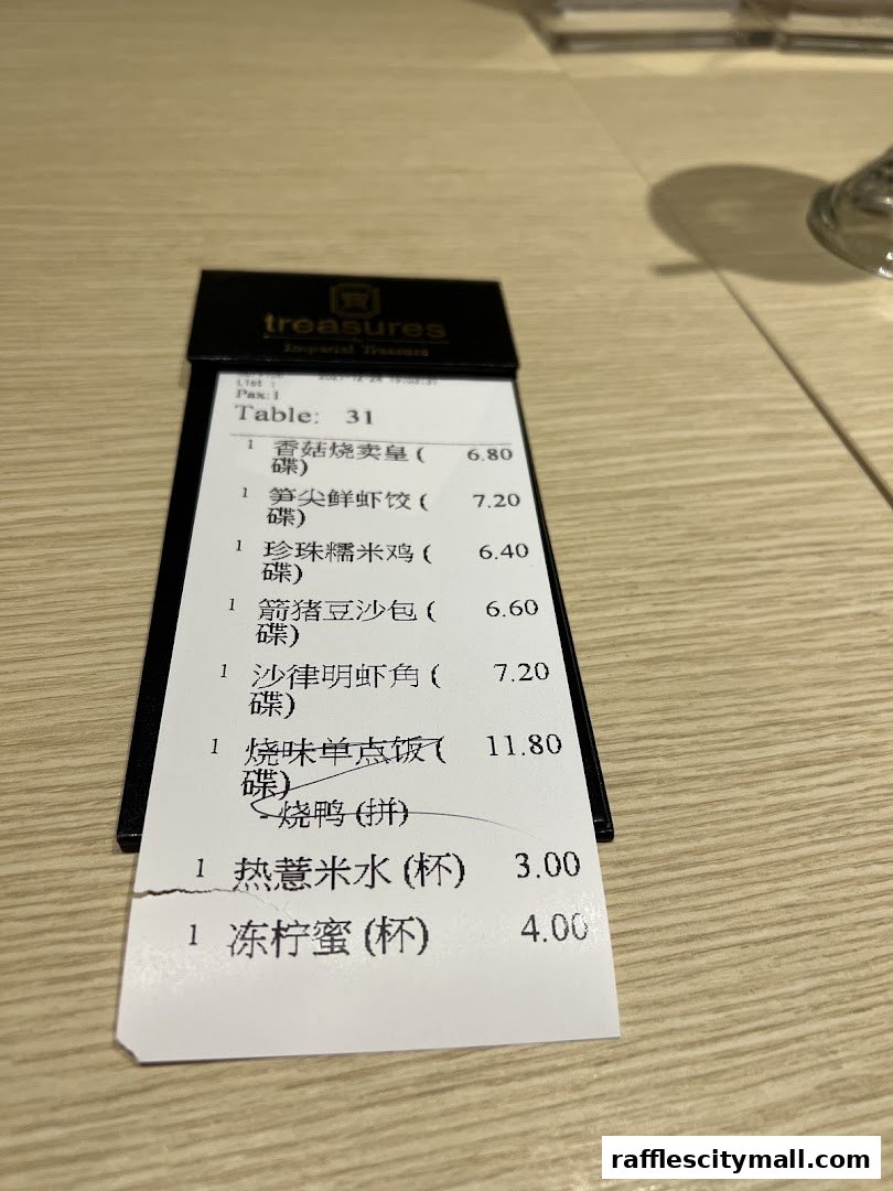 A receipt from Treasures Imperial Treasures showing a list of food items and prices.