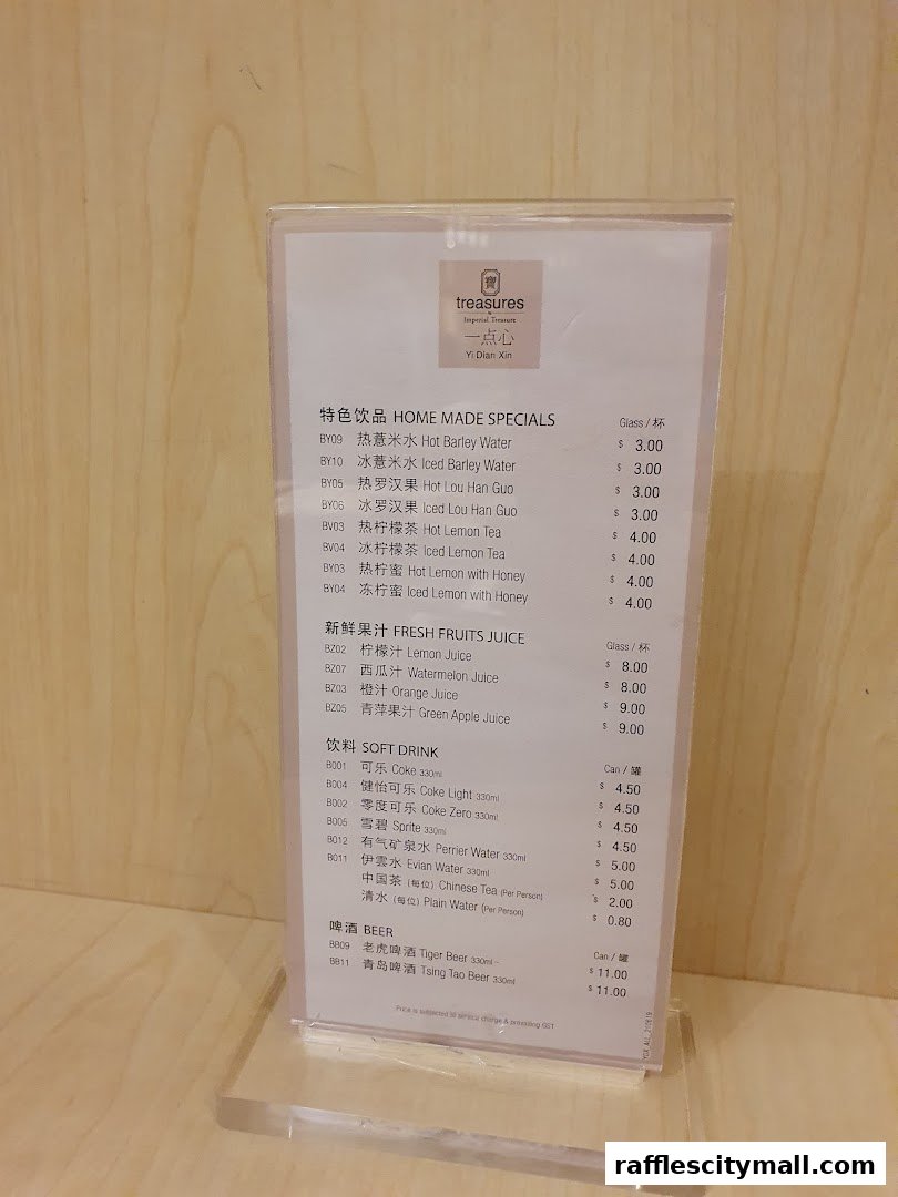 A menu from Treasures Yi Dian Xin featuring homemade specials, fresh juices, soft drinks, and beer.
