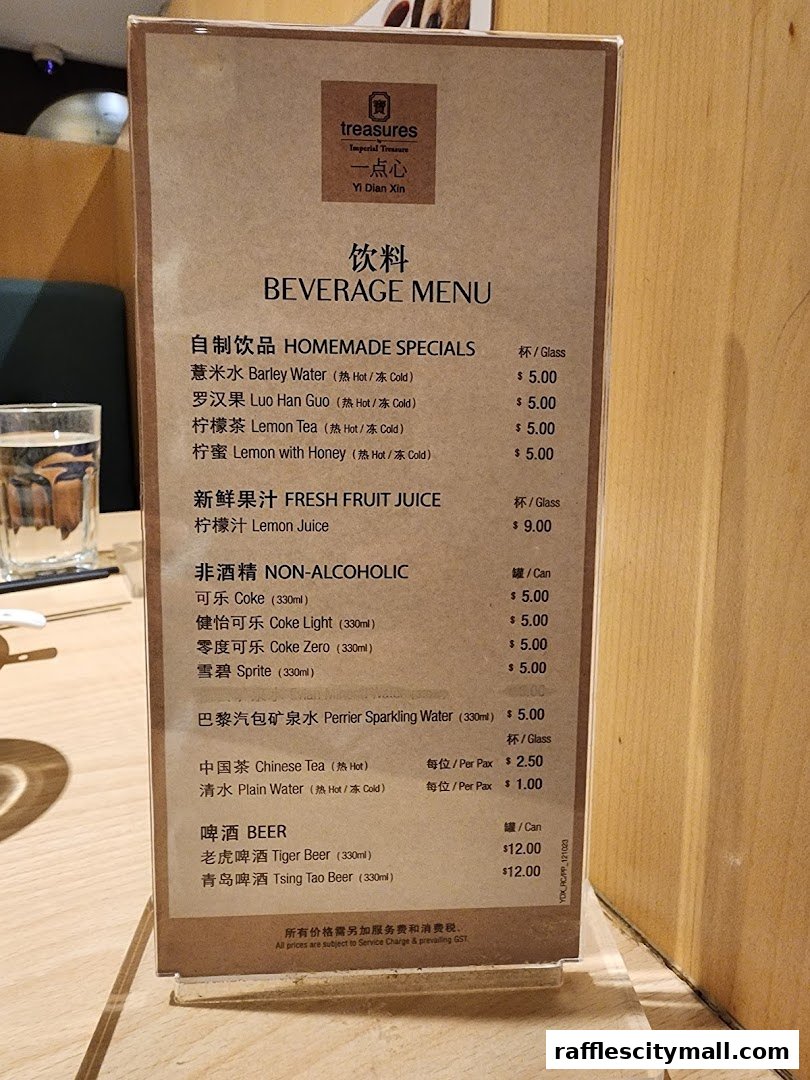 A beverage menu from Treasures Yi Dian Xin featuring homemade specials, fresh juices, non-alcoholic drinks, and beer.