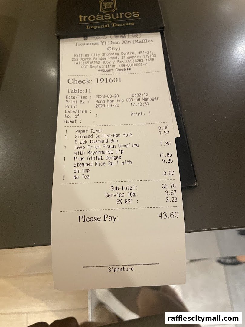 A receipt from Treasures Yi Dian Xin showing a list of dim sum items and their prices.
