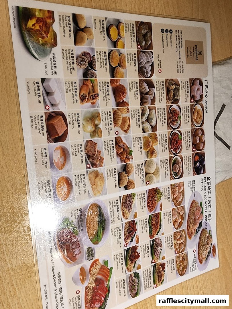 A menu from Treasures Yi Dian Xin featuring various dim sum and noodle dishes with prices.