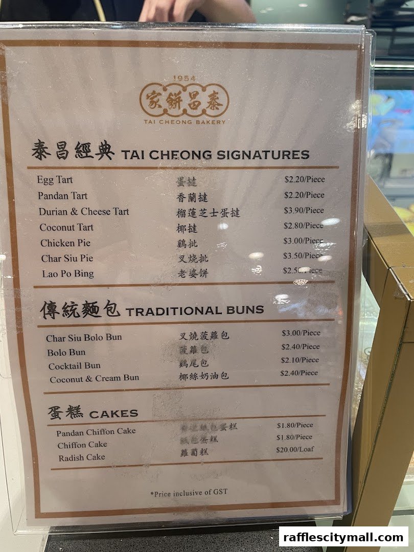 A menu from Tai Cheong Bakery featuring signature items, traditional buns, and cakes.