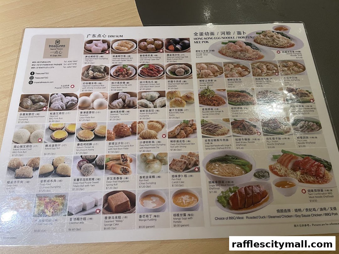 A menu from Treasures Yi Dian Xin featuring various dim sum and noodle dishes with accompanying images.