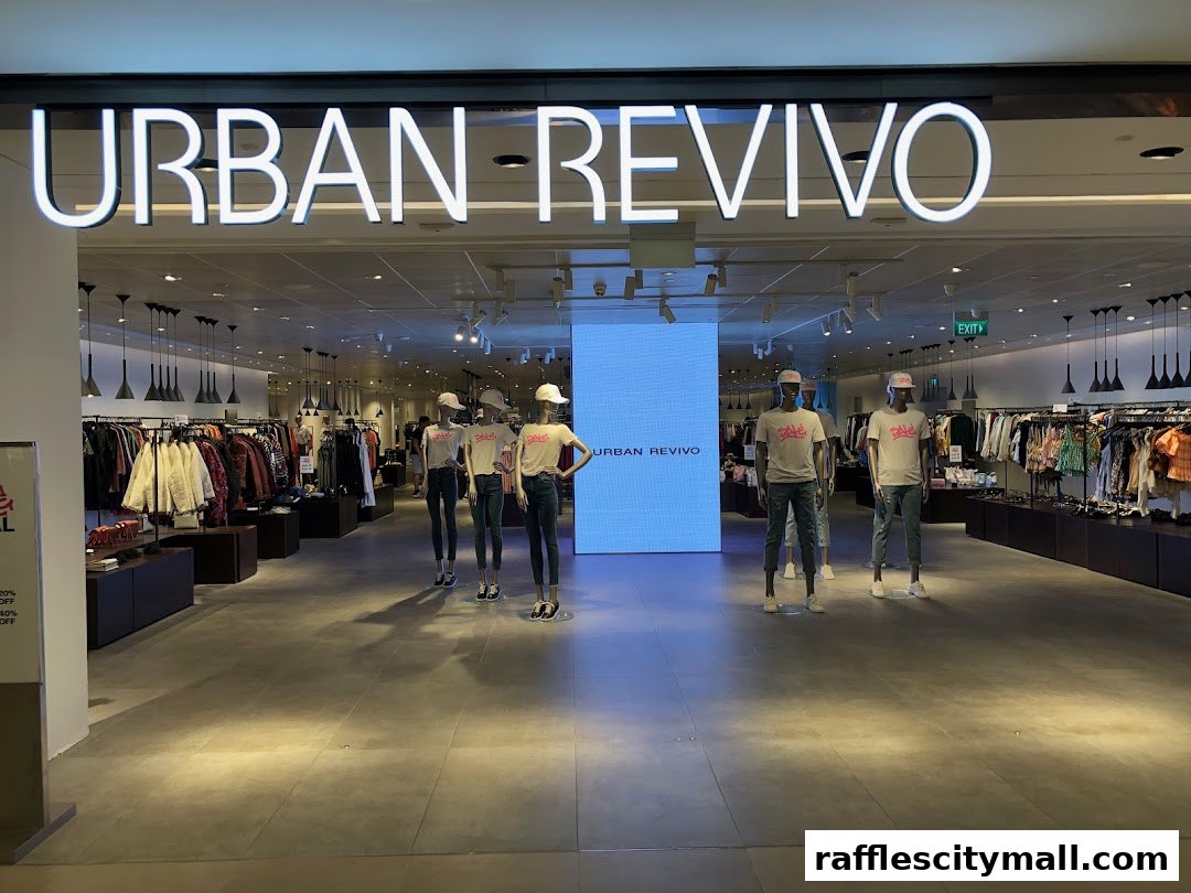 The entrance of URBAN REVIVO fashion store with mannequins and clothing displays.