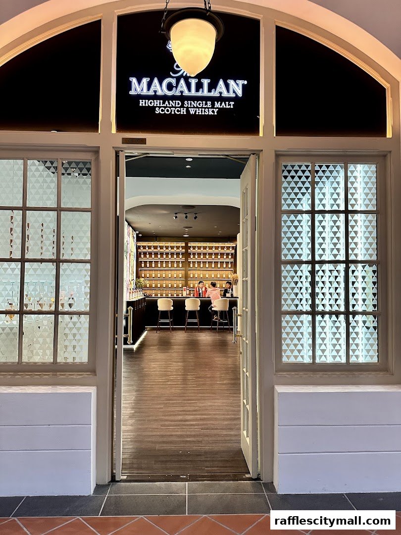 Entrance to The Macallan, a Highland Single Malt Scotch Whisky shop with a bar inside.