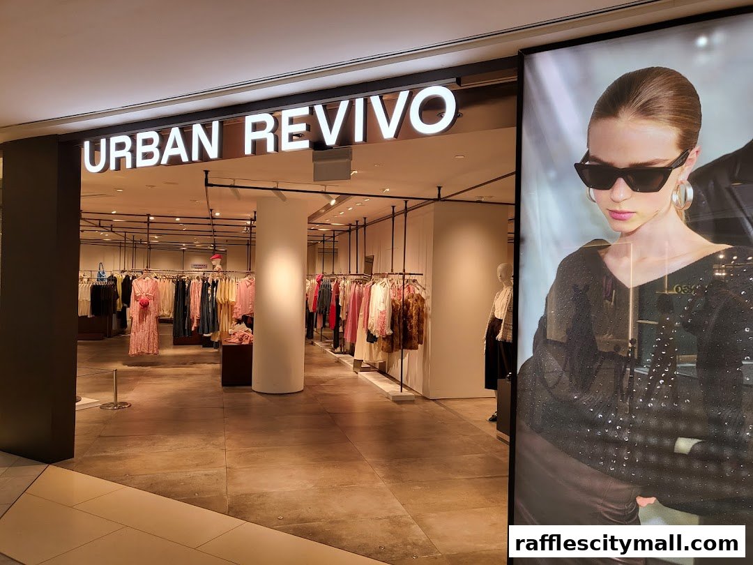 The entrance of Urban Revivo clothing store, showcasing stylish apparel and a fashion advertisement.