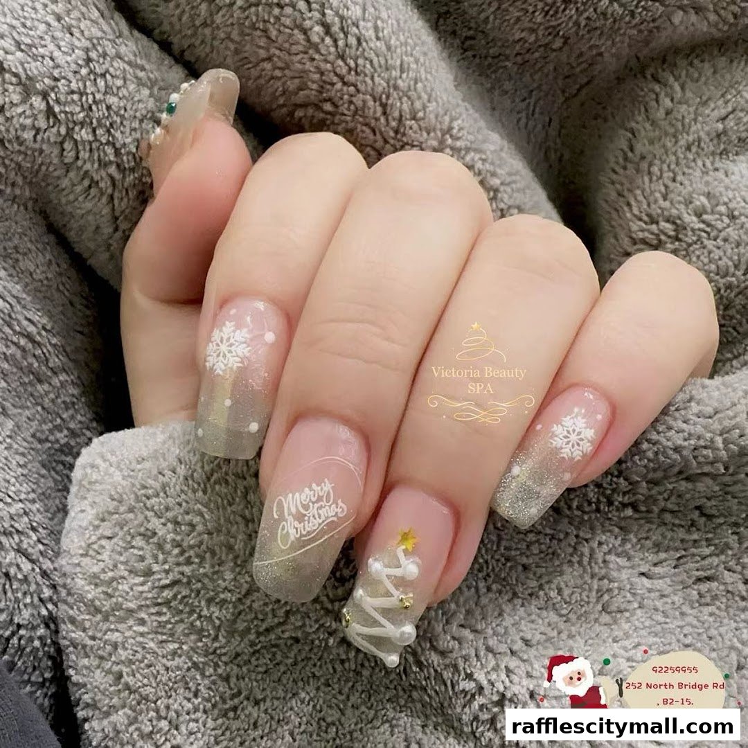 A hand with festive Christmas-themed nails, featuring snowflakes and a Christmas tree.