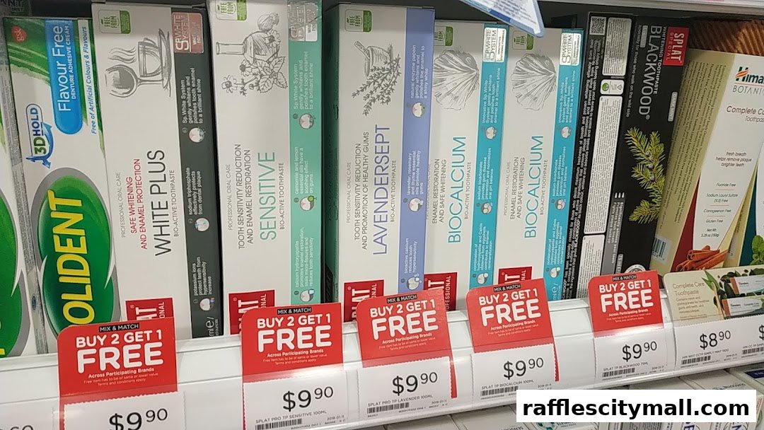 A shelf display of various toothpaste brands with 'Buy 2 Get 1 Free' promotional tags.
