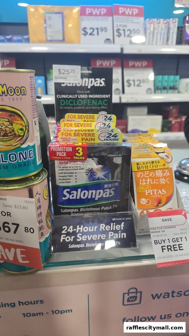 A display of pain relief patches and lozenges with promotional pricing at Watsons.