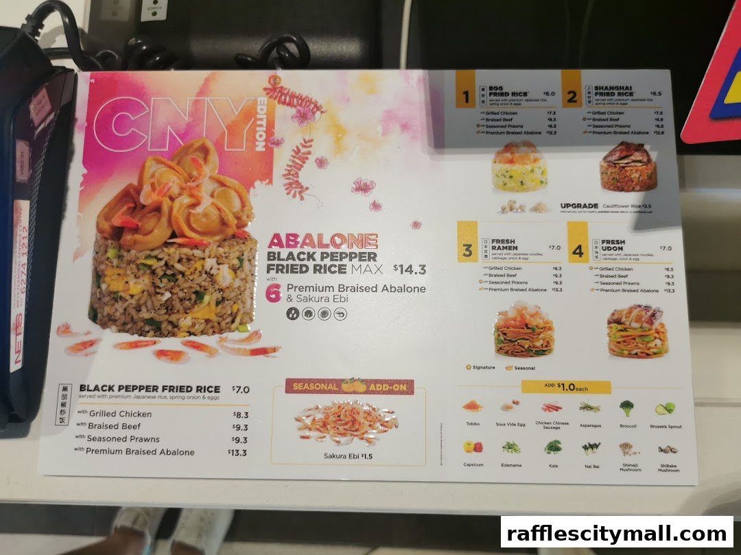 A menu board for Wok Hey featuring fried rice, ramen, and udon dishes with various protein options.