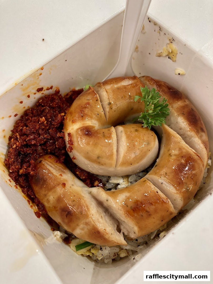 A close-up of a delicious Wok Hey meal featuring a coiled sausage and savory toppings.