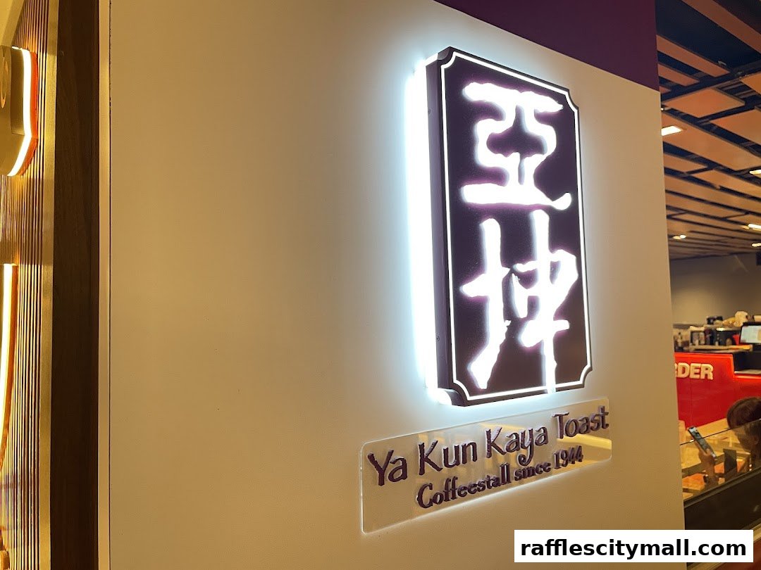 Ya Kun Kaya Toast shop sign with illuminated logo and text.