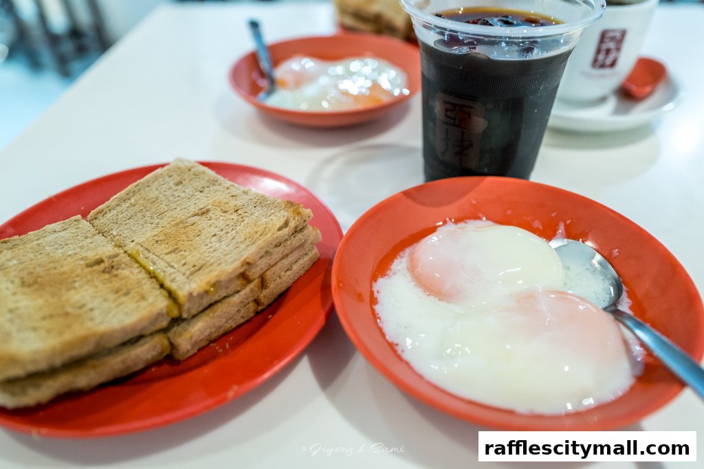 A close-up of a traditional breakfast set with toast and soft-boiled eggs, accompanied by a drink.
