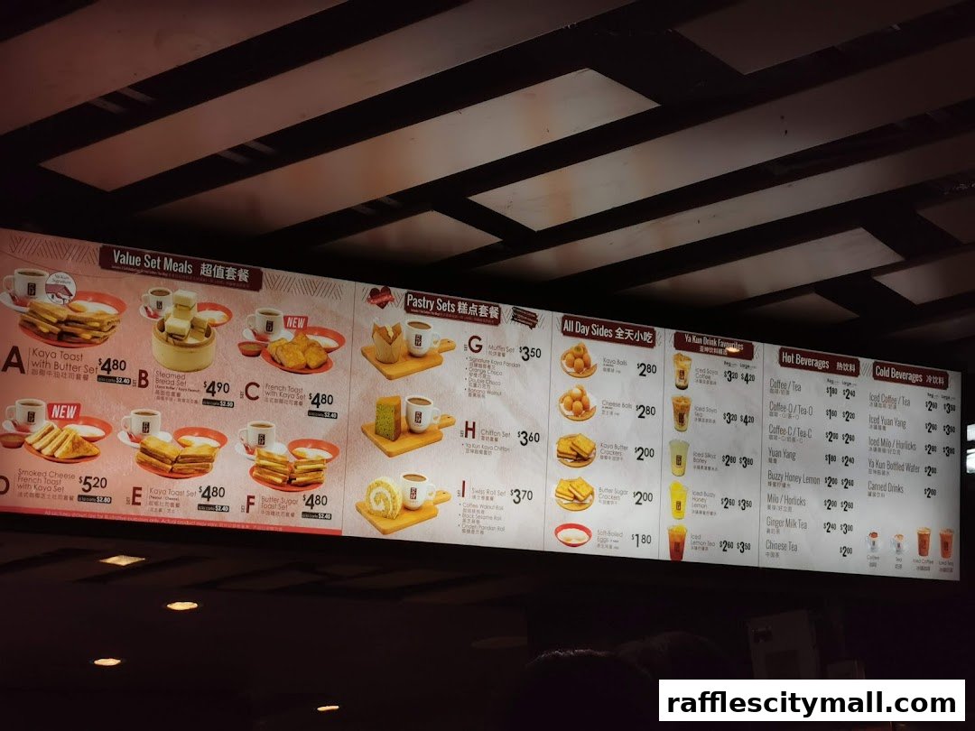 A menu board displaying various set meals, pastries, all-day sides, drinks, and beverages from Ya Kun Kaya Toast.
