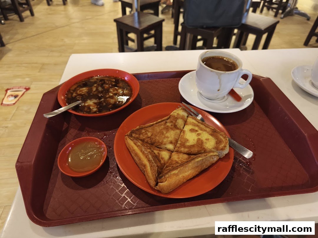 A tray with kaya toast, soft-boiled eggs, and coffee at Ya Kun Kaya Toast.