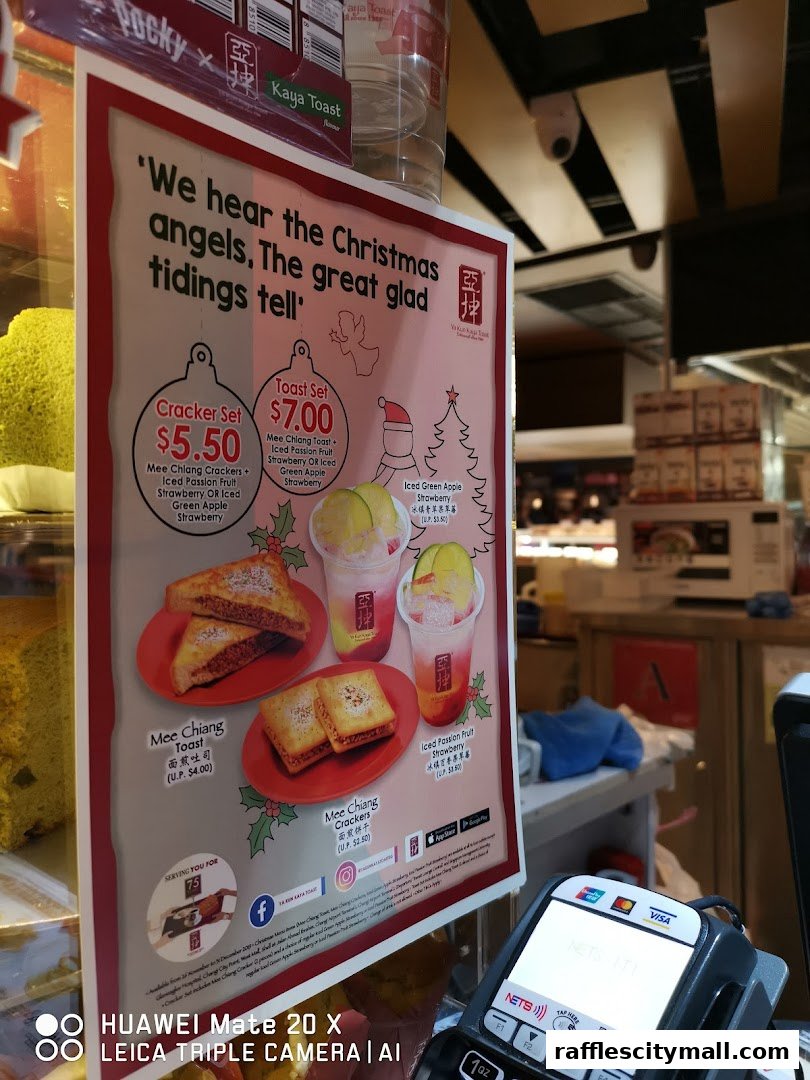 A promotional sign for Ya Kun Kaya Toast featuring Christmas specials.