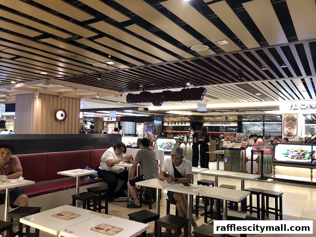 People dining at Ya Kun Kaya Toast in a food court setting with modern decor.