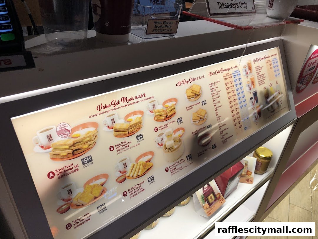 A brightly lit menu board showcasing Ya Kun Kaya Toast's value set meals and beverages.