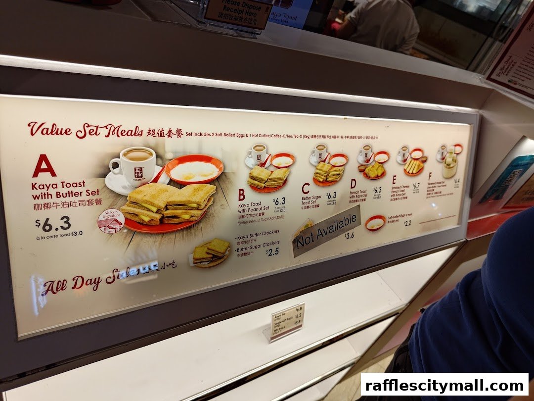 A menu board displaying various value set meals and individual items from Ya Kun Kaya Toast.