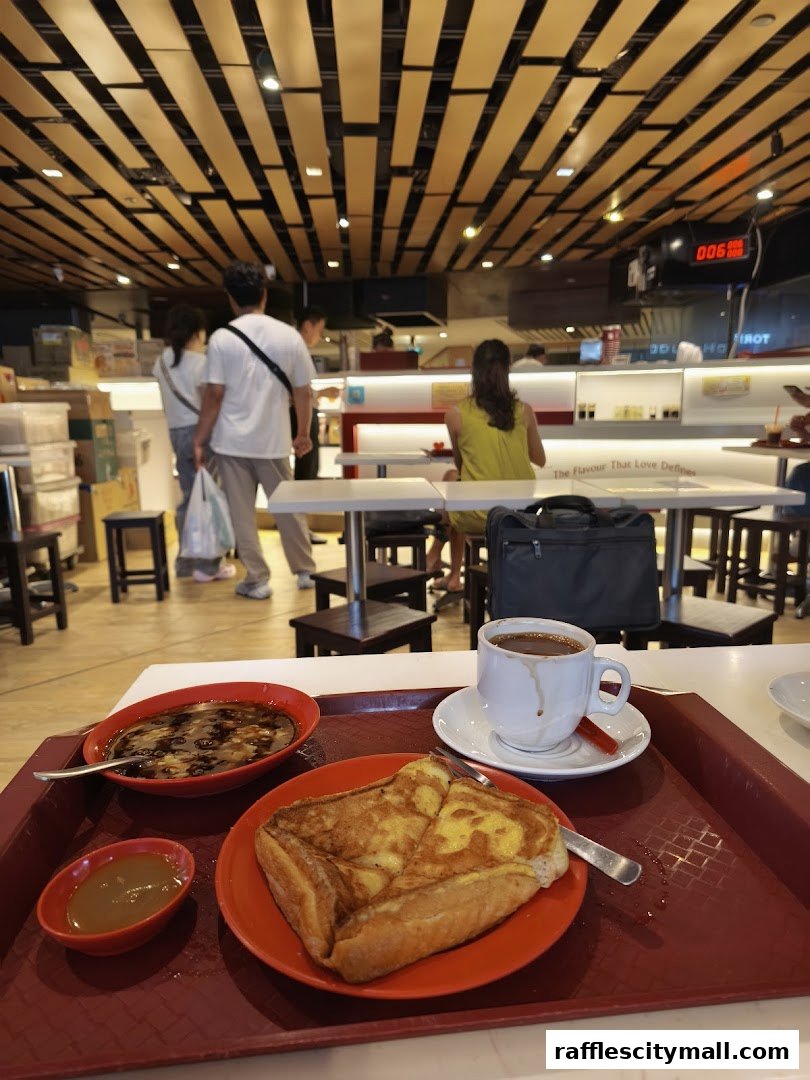 A tray of kaya toast, soft-boiled eggs, and coffee at Ya Kun Kaya Toast.