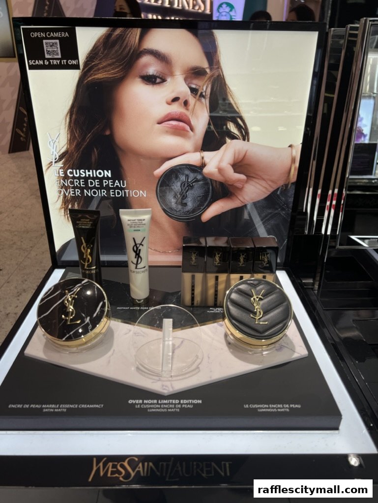 YSL Beauty display featuring cushion foundations and a model with makeup.