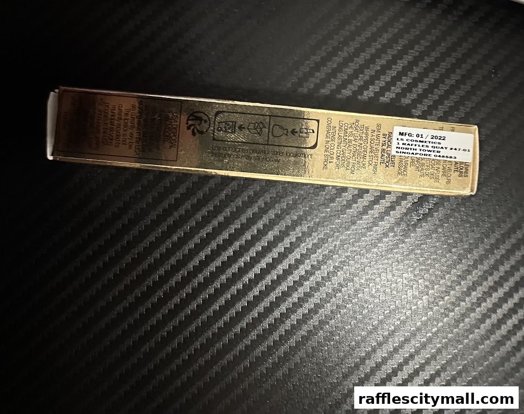 A close-up of a YSL Beauty lipstick product packaging with detailed information.
