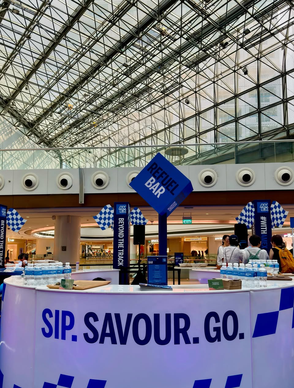 SP.SAVOUR.CO. Beyond the Track bar with Amex branding