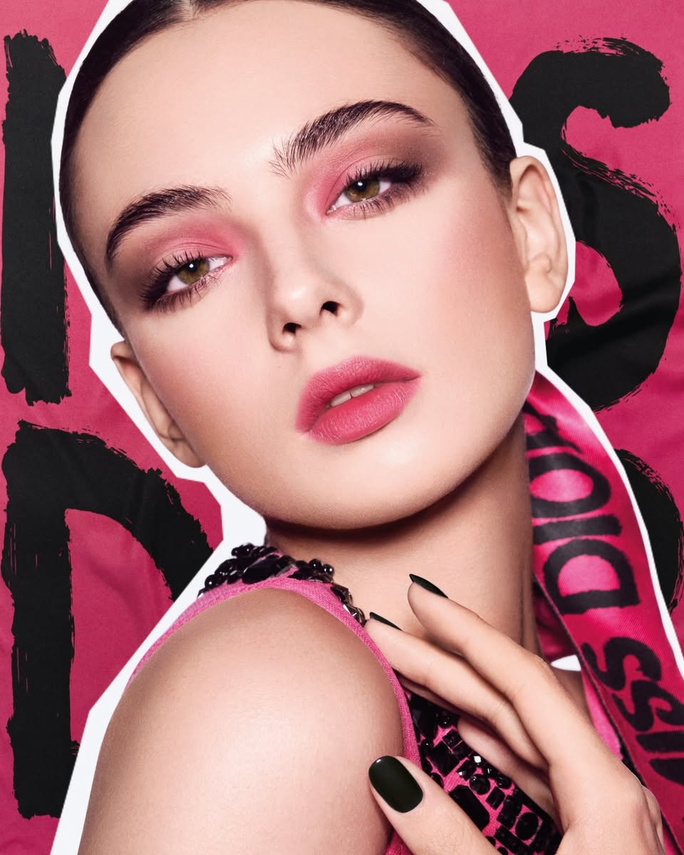 A close-up of a Miss Dior makeup look featuring shocking pink elements