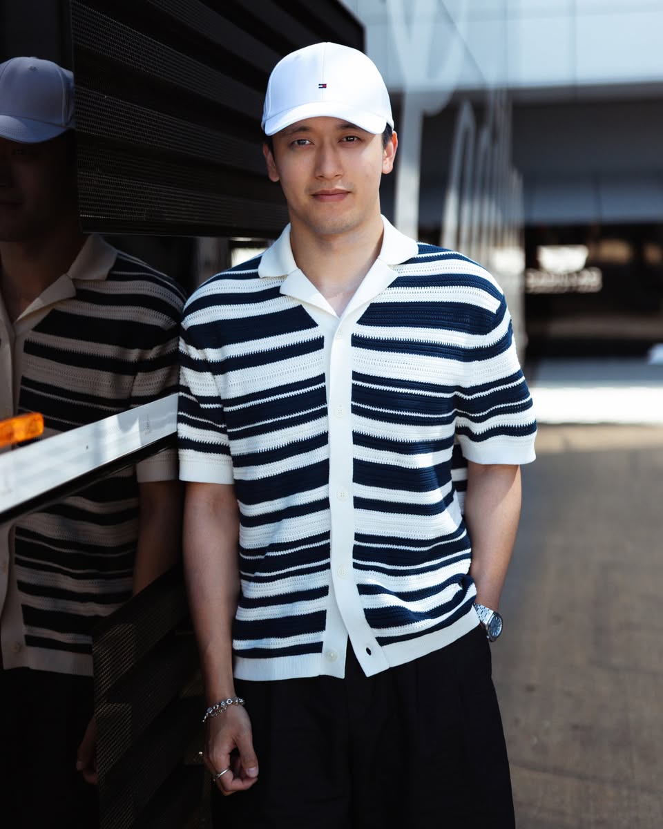 Zhou Guanyu wearing Tommy Hilfiger cap outdoors